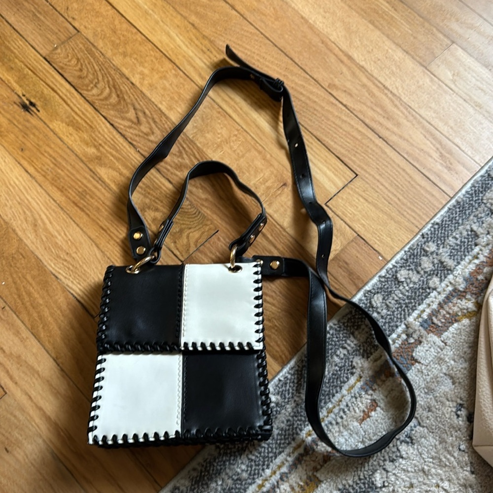 Black and white leather crossbody or handheld bag